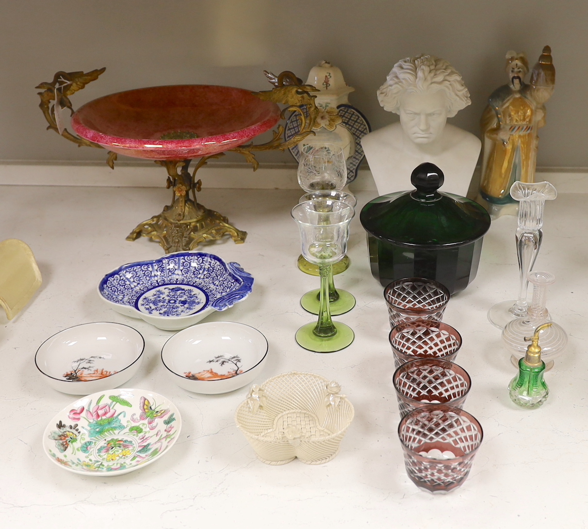 A French ruby lustre and ormolu mounted centrepiece, a green faceted glass bowl and cover, two Nymphenburg dishes, a pearlware dessert dish and other ceramics and glass